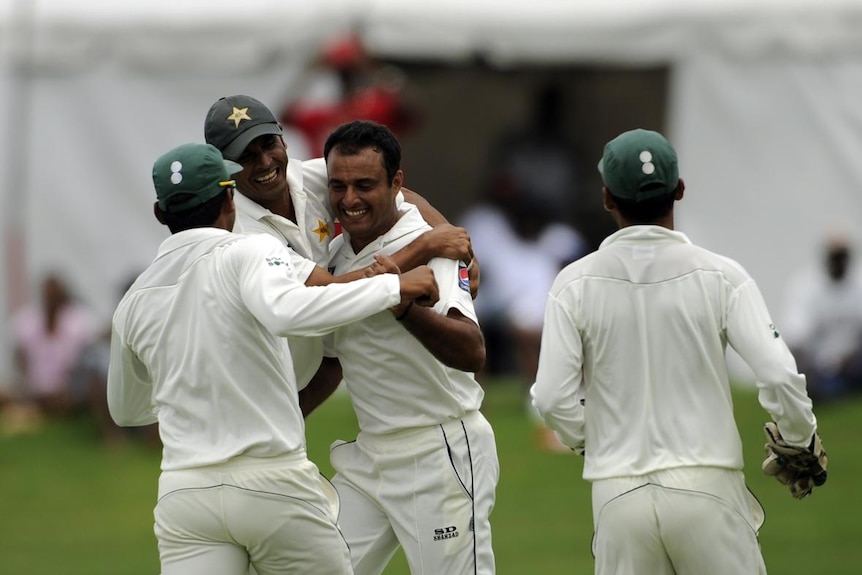 Tanvir Ahmed celebrates after Lendl Simmons is caught during day two of the second Test