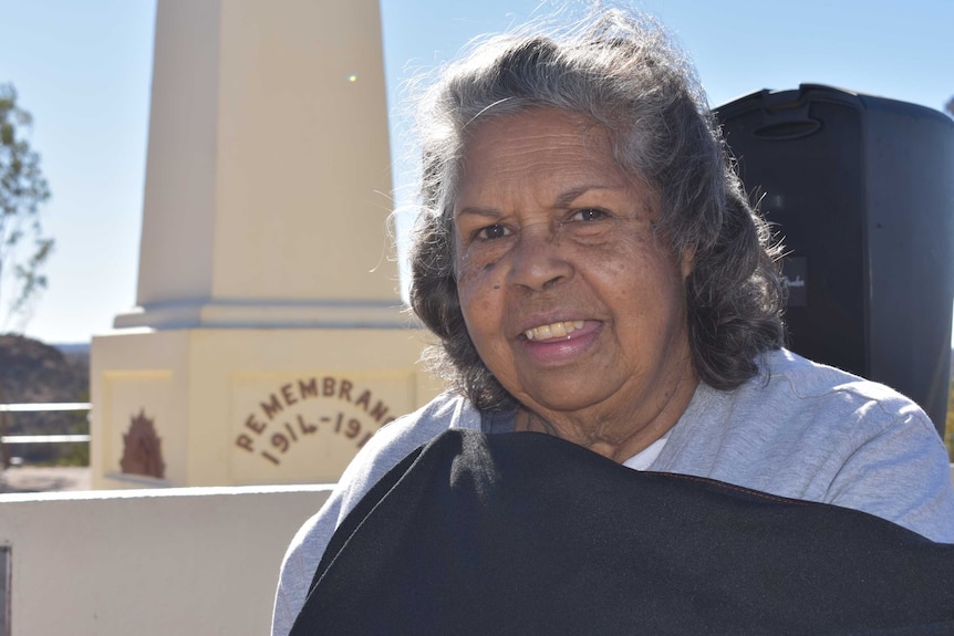 Patricia Ansell Dodds pictured in front of a WWII memorial at Anzac Hill in Alice Springs