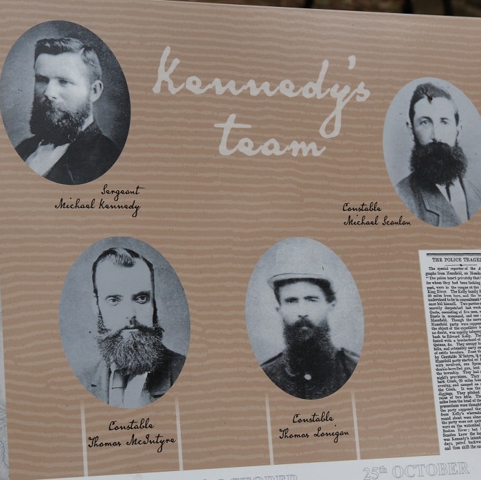 Signs at new Stringybark Creek Reserve Memorial show faces of four policemen involved in Kelly Gang shootout in 1878.