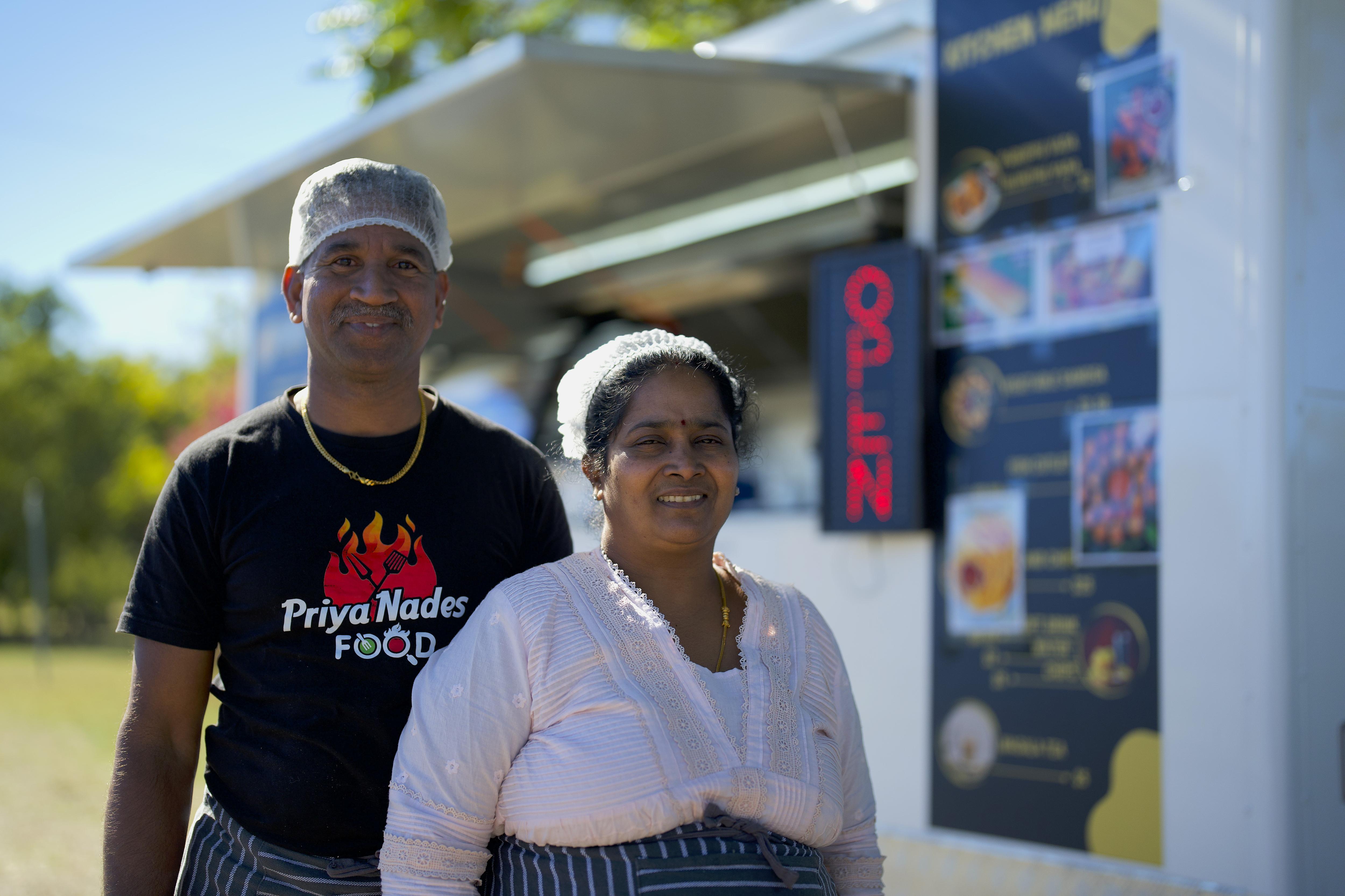 Nades and Priya in front of their food truck