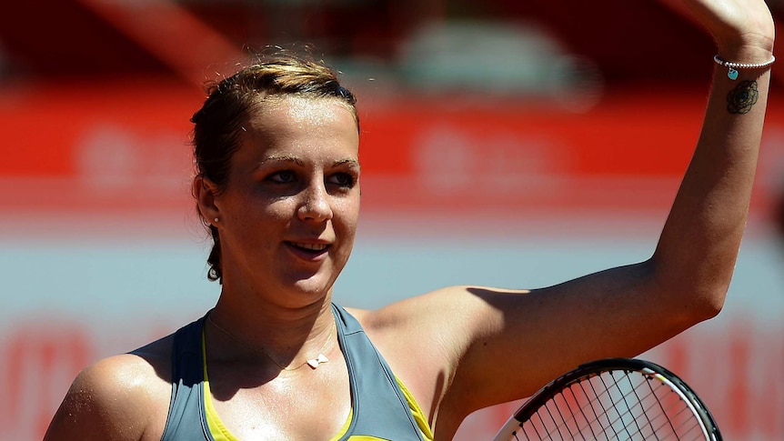 Russia's Anastasia Pavlyuchenkova waves to the crowd after winning her Portugal Open semi-final.