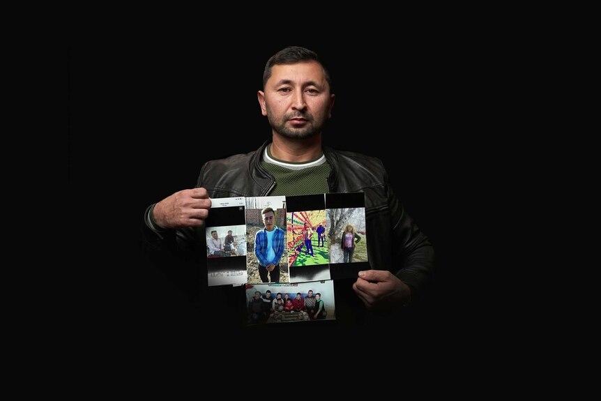 Azmat Omarhoje, 37, holds up photos of his missing relatives.