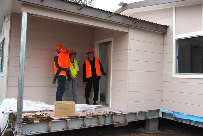 Vince Boney and his family are shown their new home