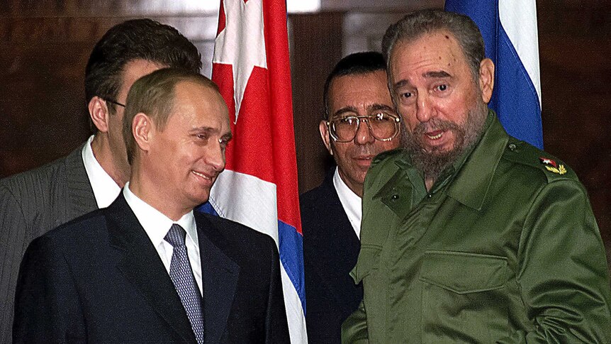 Russian President Vladimir Putin, left, and Cuban President Fidel Castro.