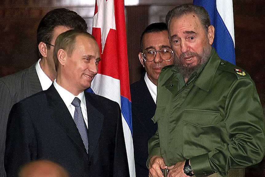 Russian President Vladimir Putin, left, and Cuban President Fidel Castro.