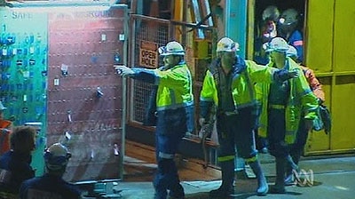 Todd Russell and Brant Webb emerge from the Beaconsfield mine shaft.