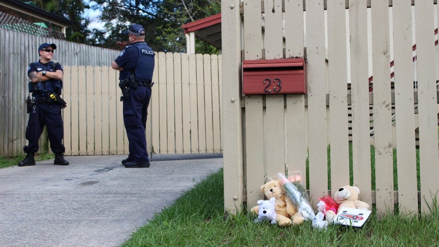 Flowers and teddy bears left outside a Woodridge house