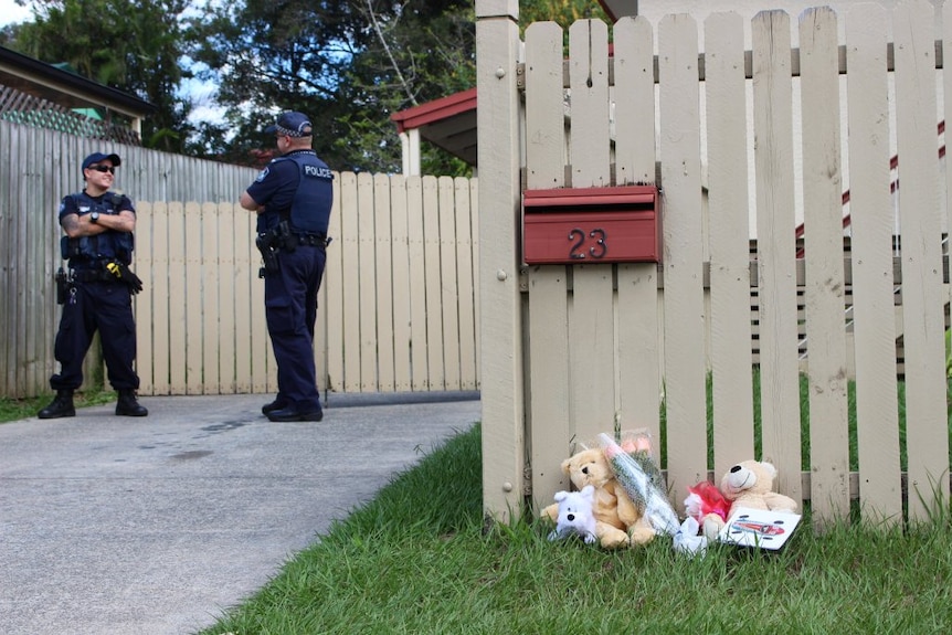 Flowers and teddy bears left outside a Woodridge house.