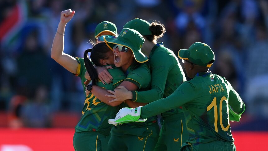 Shabnim Ismail celebrates with her teammates