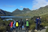 Tourists take in the view at Cradle Mountain
