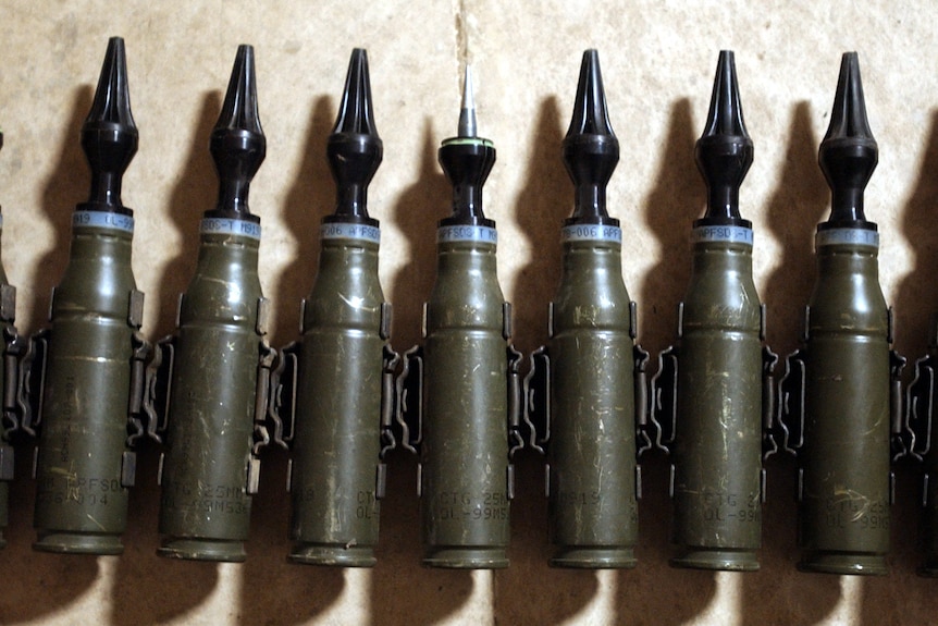 A row of US Army 25mm rounds of depleted uranium ammunition.