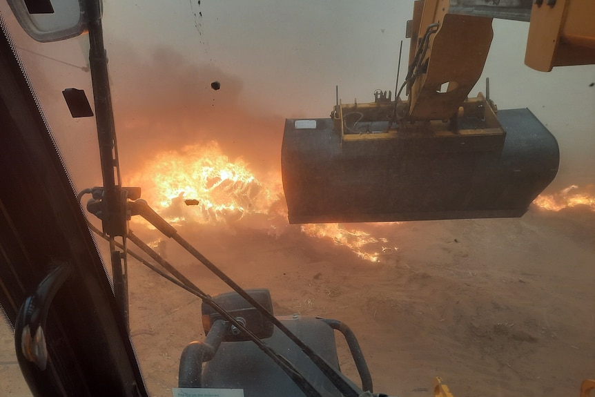 A tractor in a field fire 