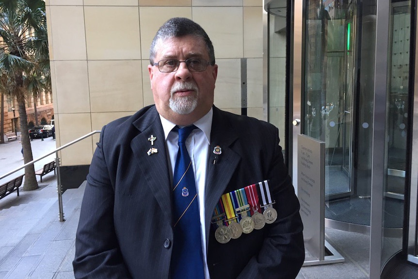 Glen Greaves outside the royal commission building.