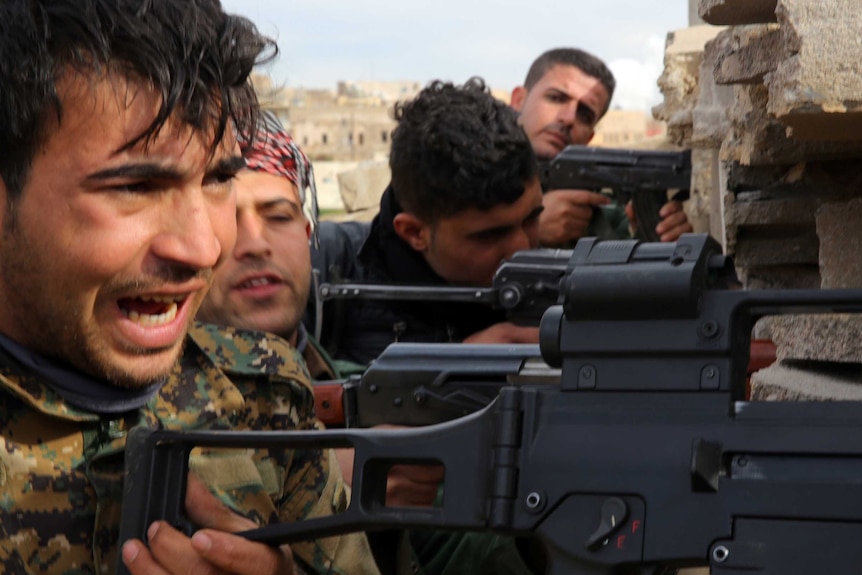 Kurdish and Yazidi fighters battle ISIS in Sinjar
