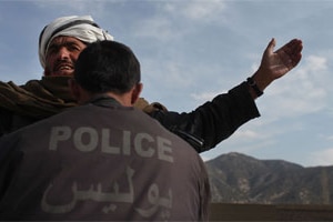 File photo: A man is searched for weapons by a member of the Afghan National Police (ANP) (Getty Images: Spencer Platt)
