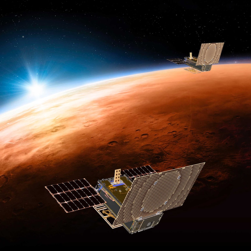 An artist's impression of two small satellites flying over Mars.