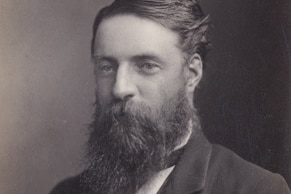 A  black and white photograph of a man in an old fashioned suit and long beard