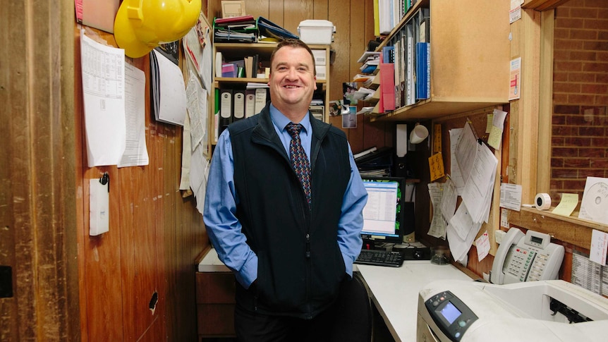 Piedimonte's store manager Trevor stands in a small office overlooking the floor