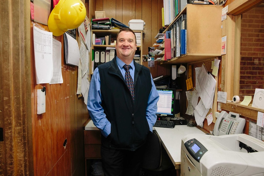 Piedimonte's store manager Trevor stands in a small office overlooking the floor