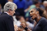US Open director Brian Earley clasps his hands together as Serena Williams yells at him.