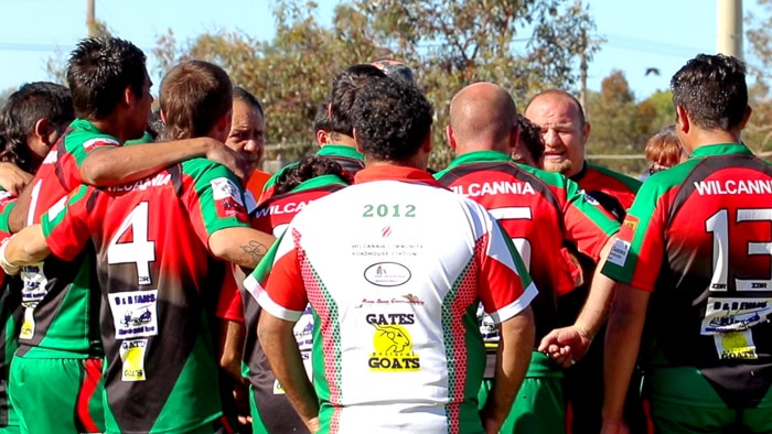 Boomerangs form a huddle after beating Broken Hill Saints.