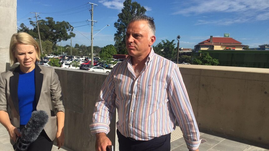 Owner of tyre recycling business Antonio Di Carlo walking outside Beenleigh Magistrates Court.