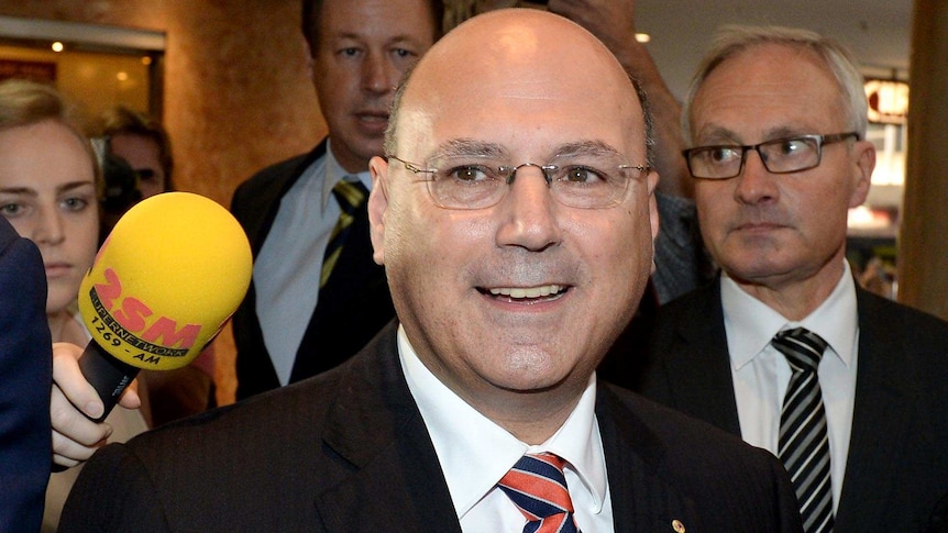 It's grins all round as Senator Arthur Sinodinos arrives at the ICAC hearing into Australian Water Holdings.
