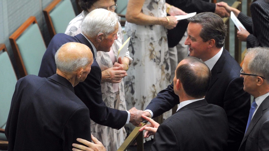 David Cameron and Tony Abbott speak to war veterans Murray and Eric Maxton