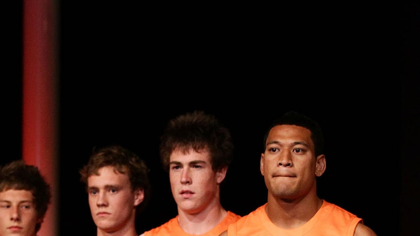 One Giant leap ... star recruit Israel Folau and his team-mates model one of the GWS strips.