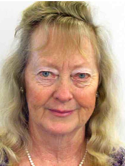 A headshot of a woman with long blond hair.