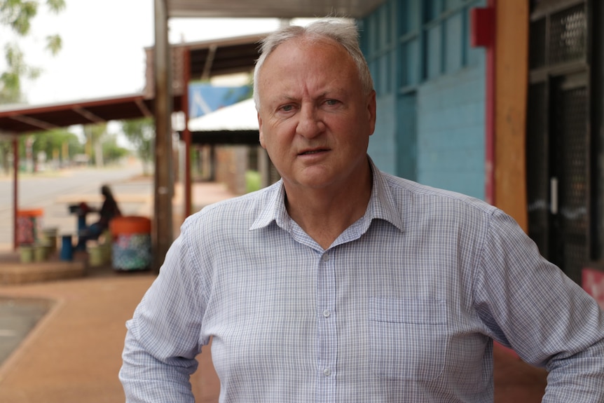 Steve Edgington looks at the camera while standing outside on a street in Tennant Creek.