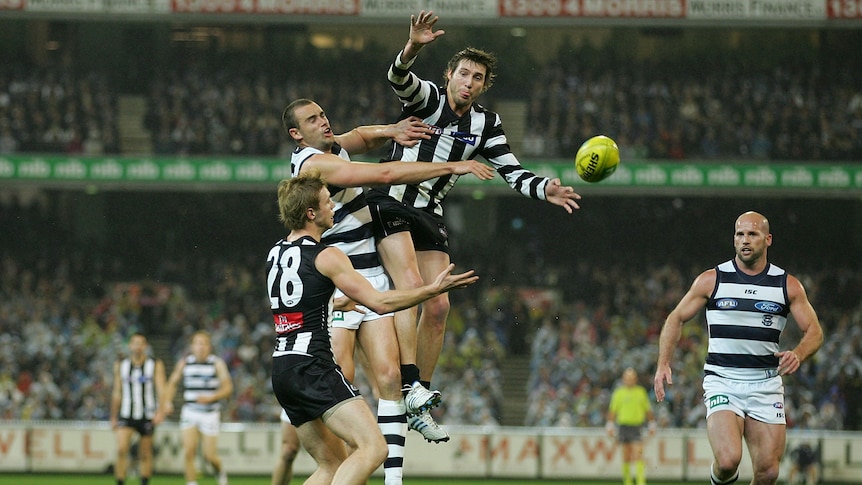 Flying high ... Collingwood star Dale Thomas soars for the footy at the MCG.