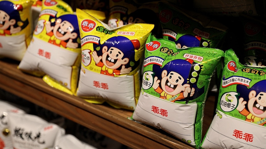 Kuai Kuai corn puff packets on a shelf. 