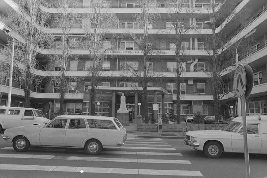 Cars drive outside the Royal Prince Alfred Hospital in Sydney.