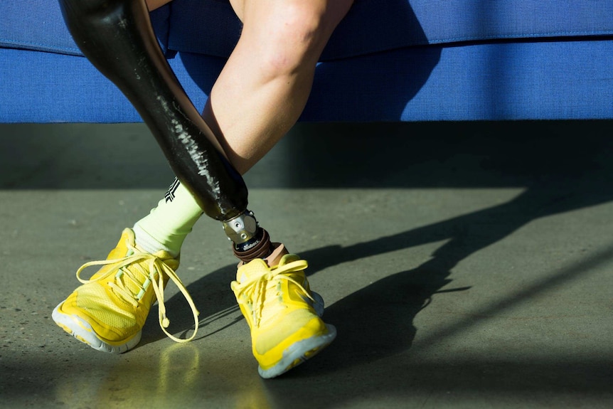 A human leg and a prosthetic leg.