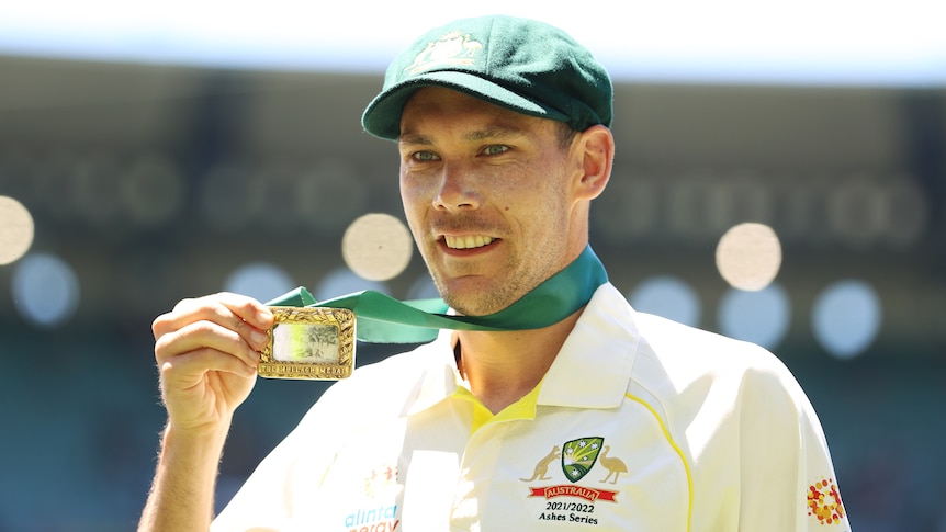 Australia bowler Scott Boland holds up the Johnny Mullagh Medal after the MCG Ashes Test.