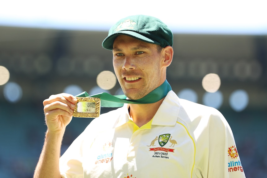 Australia bowler Scott Boland holds up the Johnny Mullagh Medal after the MCG Ashes Test.