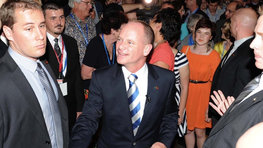 Campbell Newman is congratulated on arrival to a function at the Hilton Hotel in Brisbane