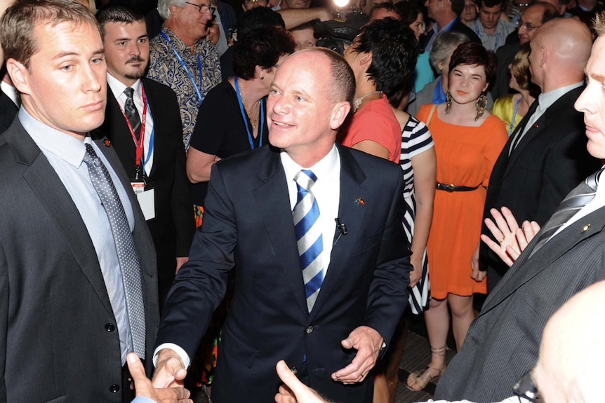 Campbell Newman is congratulated on arrival to a function at the Hilton Hotel in Brisbane