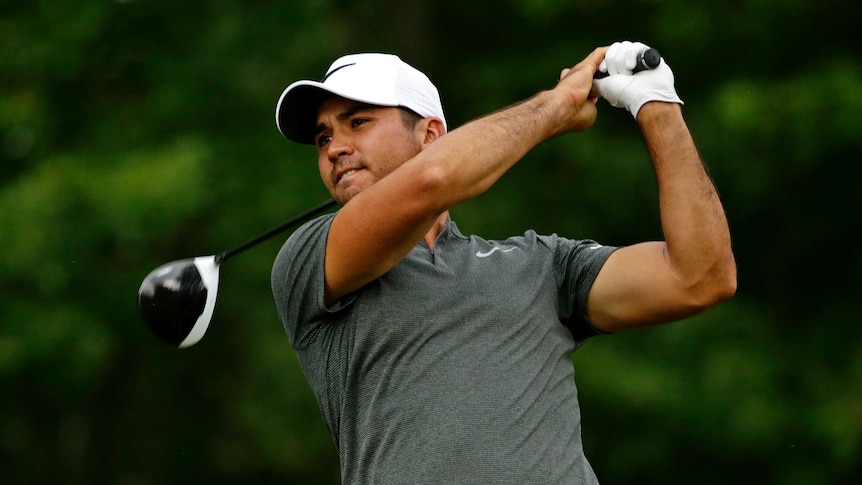 Jason Day tees off on the 15th hole.