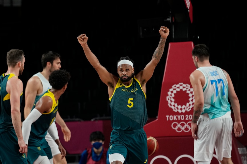 Australian basketball player Patty Mills raises his fists during the bronze-medal game against Slovenia at the Tokyo Olympics.