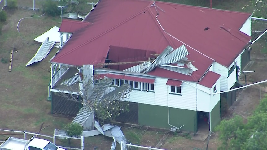 The roof of a Winya home is damaged and corrugated iron sticks out of it