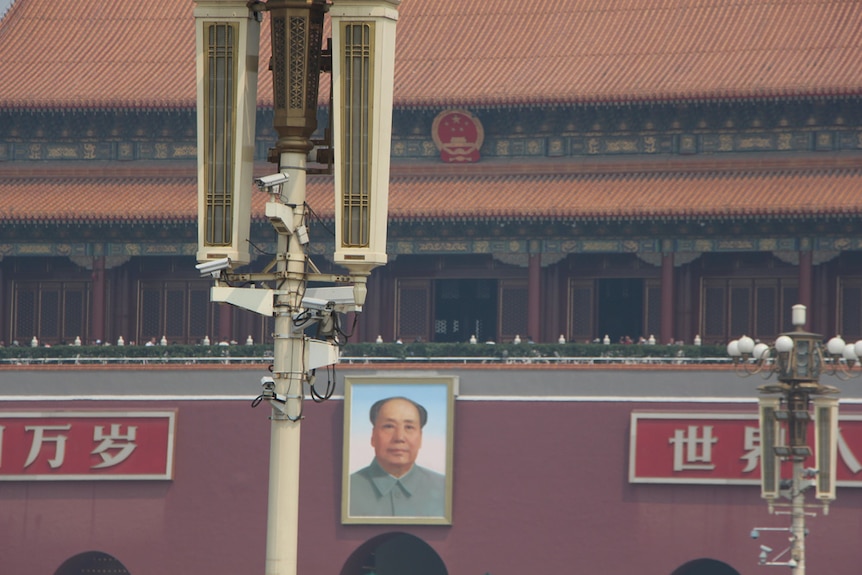 Tiananmen Square security camera's near Mao's photo at the forbidden city