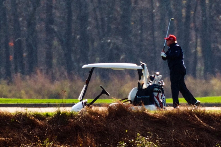 US President Donald Trump plays golf at Trump National Golf Club