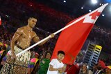 Flagbearer Pita Taufatufoa of Tonga leads his contingent during the Rio Olympics opening ceremony.