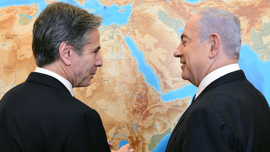  US Secretary of State Antony Blinken meets Israeli Prime Minister Benjamin Netanyahu speak in front of world map