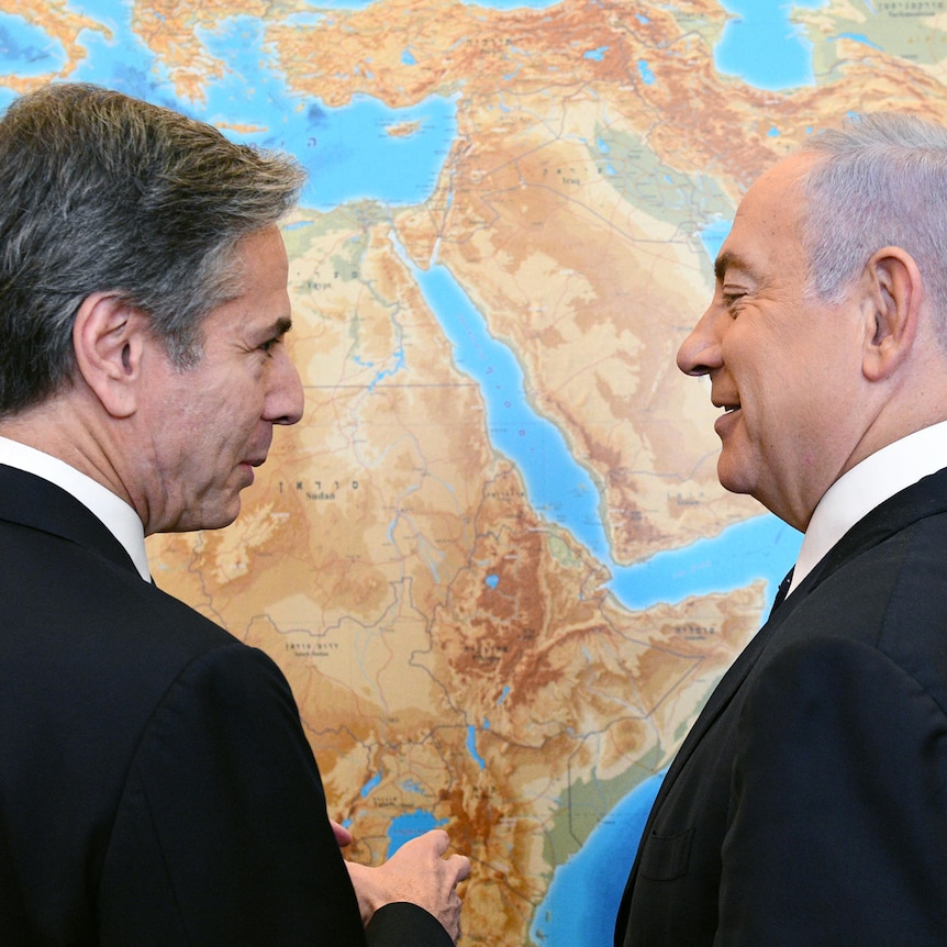  US Secretary of State Antony Blinken meets Israeli Prime Minister Benjamin Netanyahu speak in front of world map