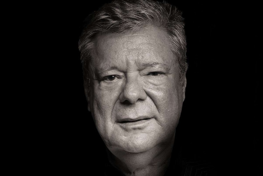 A black-and-white portrait of author and forensic psychologist Tim Watson-Munro.
