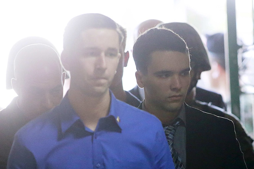 Joseph Scott Pemberton is escorted into a court room.