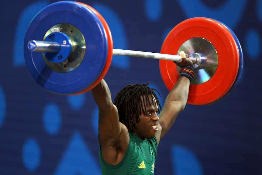 Daniel Koum lifts at the Delhi 2010 Commonwealth Games.